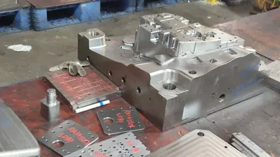 Khuôn kim loại gia công CNC tại một xưởng NexaTrans đến khảo sát, 5/2026.